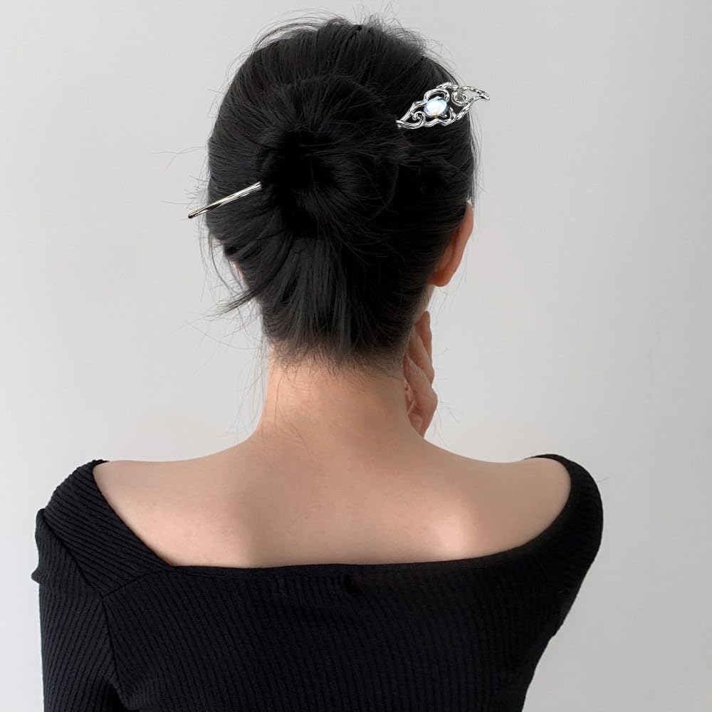 SANNIDHI vintage silver hairpins being inserted into a secure long hair bun updo.