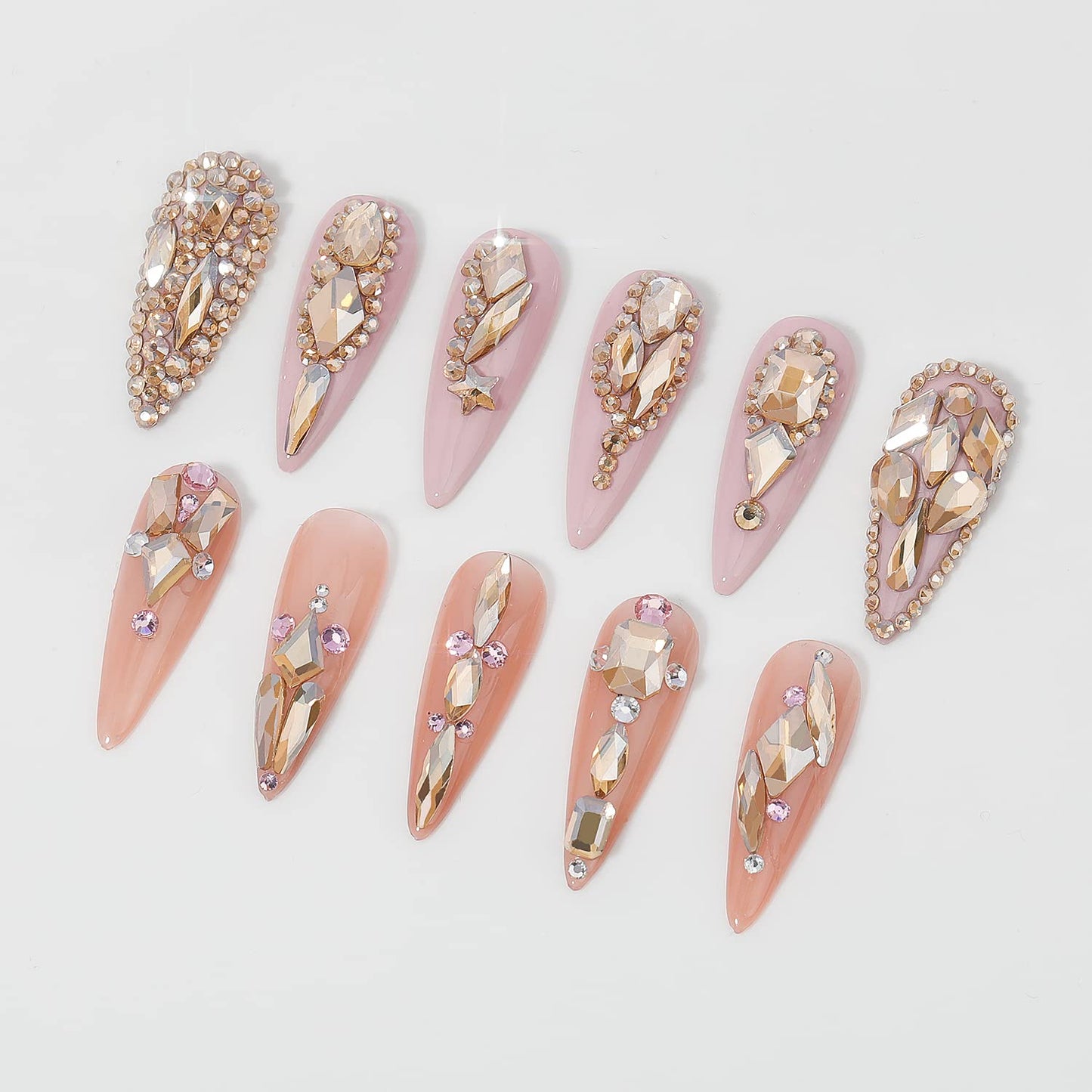 Professional nail art design using champagne gold rhinestones.