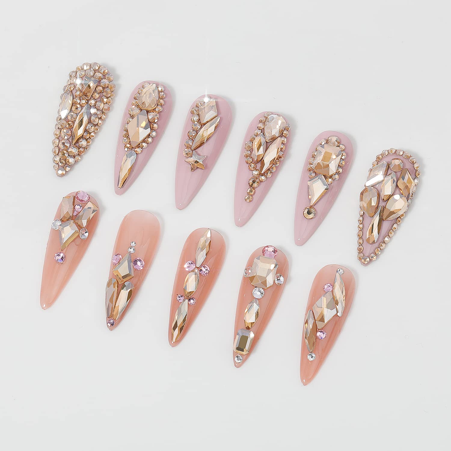 Professional nail art design using champagne gold rhinestones.