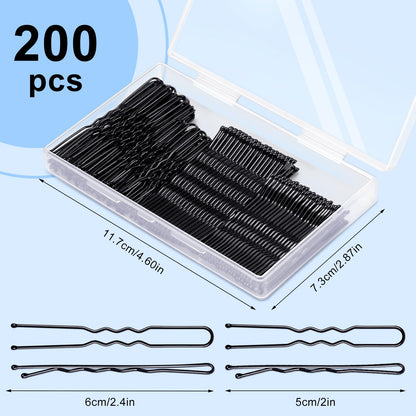 TsMADDTs black bobby pins and U shaped hair pins spread out on a clean background