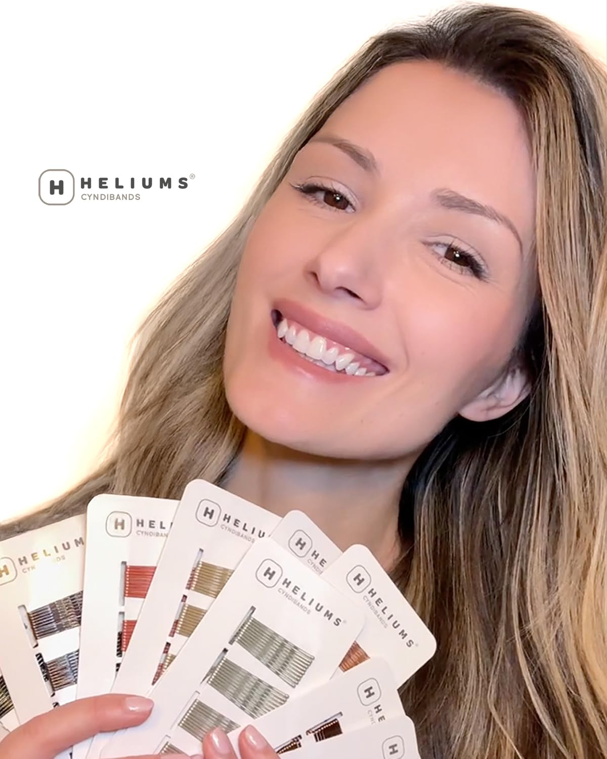 Discreet mini bobby pins by Heliums showing the light blonde color match finish