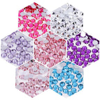Rhinestones displayed alongside nail art design tools