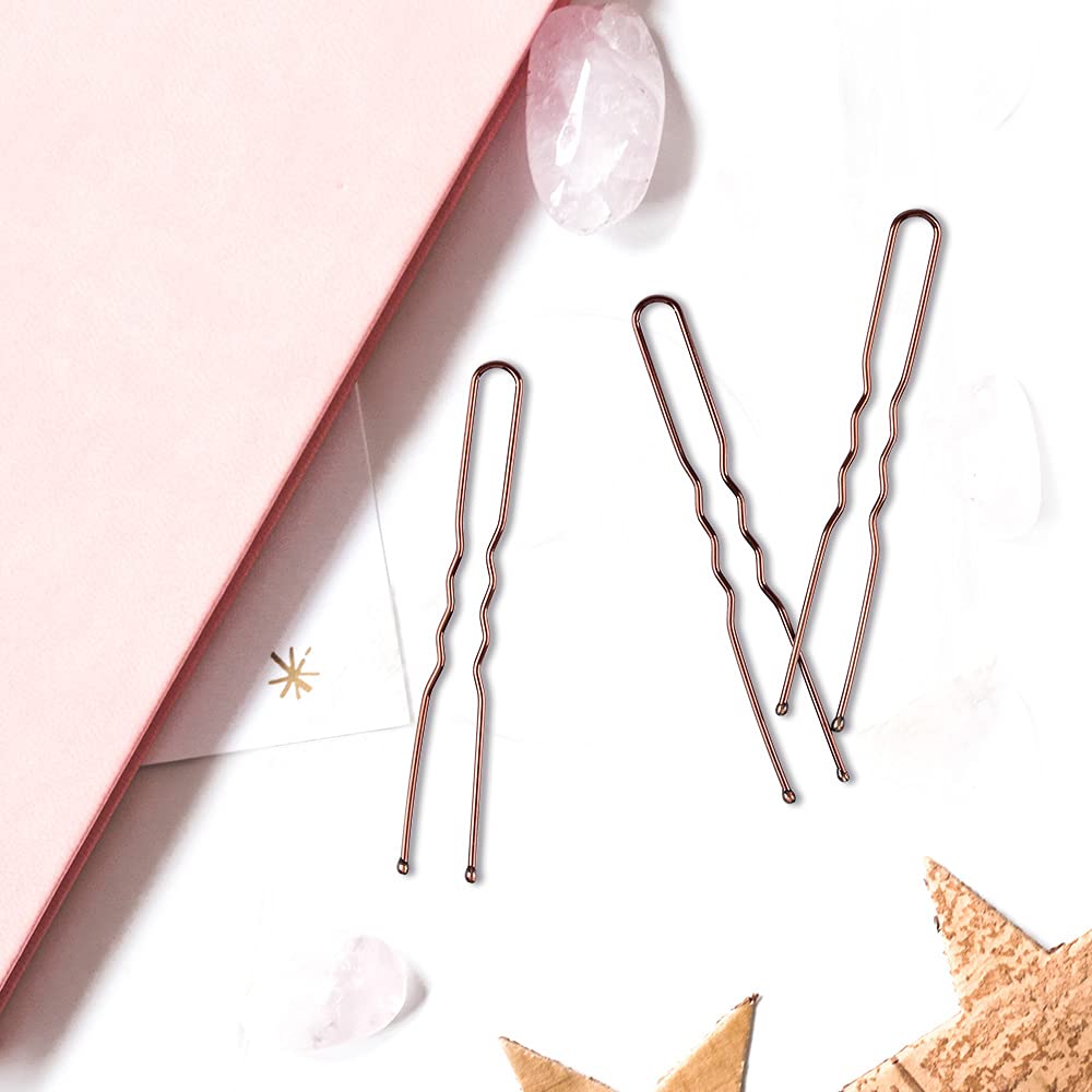Eighty pieces of brown U-shaped bobby pins arranged neatly on a flat surface
