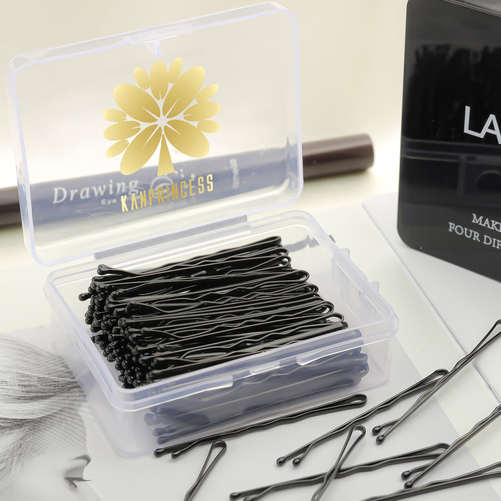 Durable rust resistant hairpins for women and girls neatly organized inside a clear plastic vanity case.