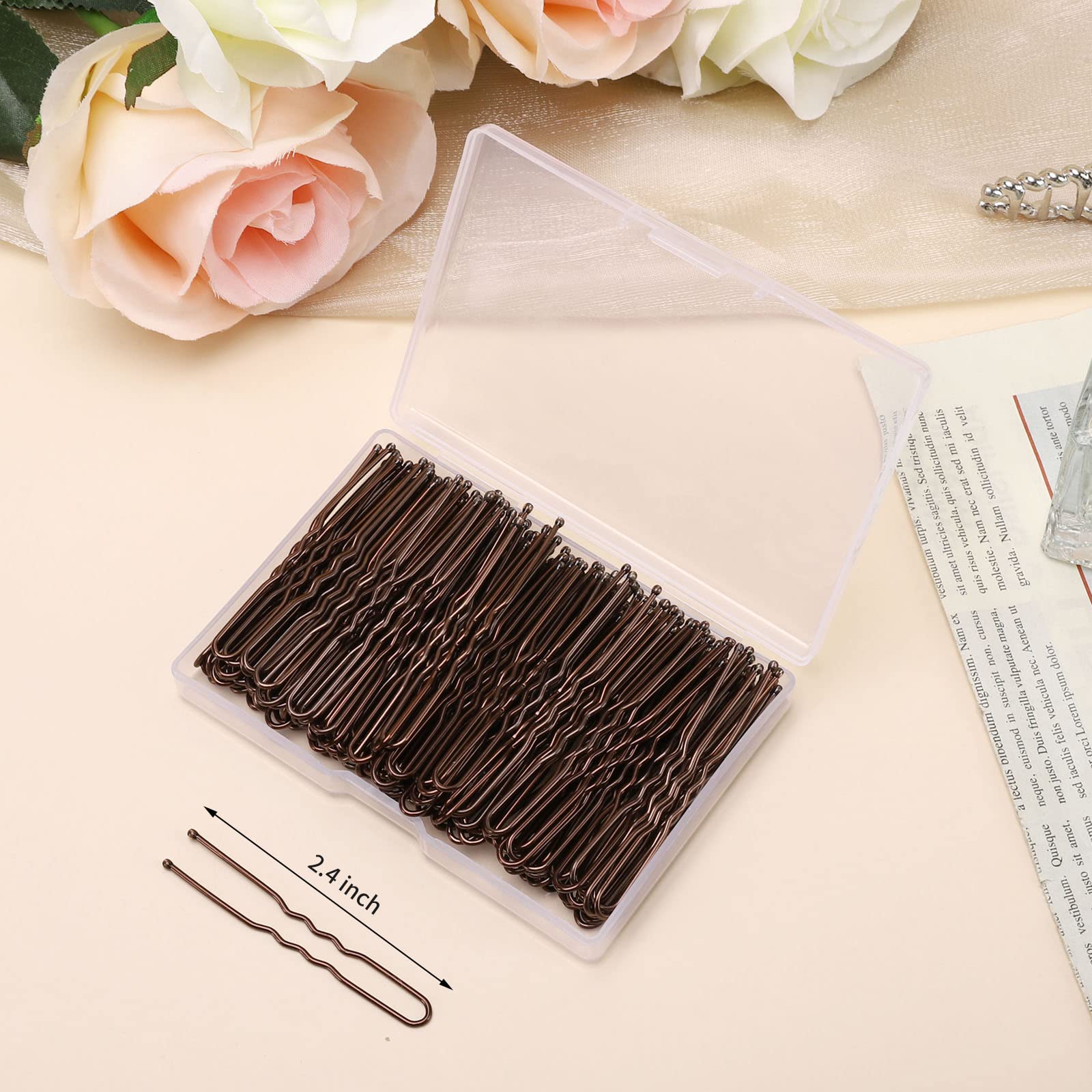 Close up view of two point four inch waved hair pins highlighting the protective smooth round tips.