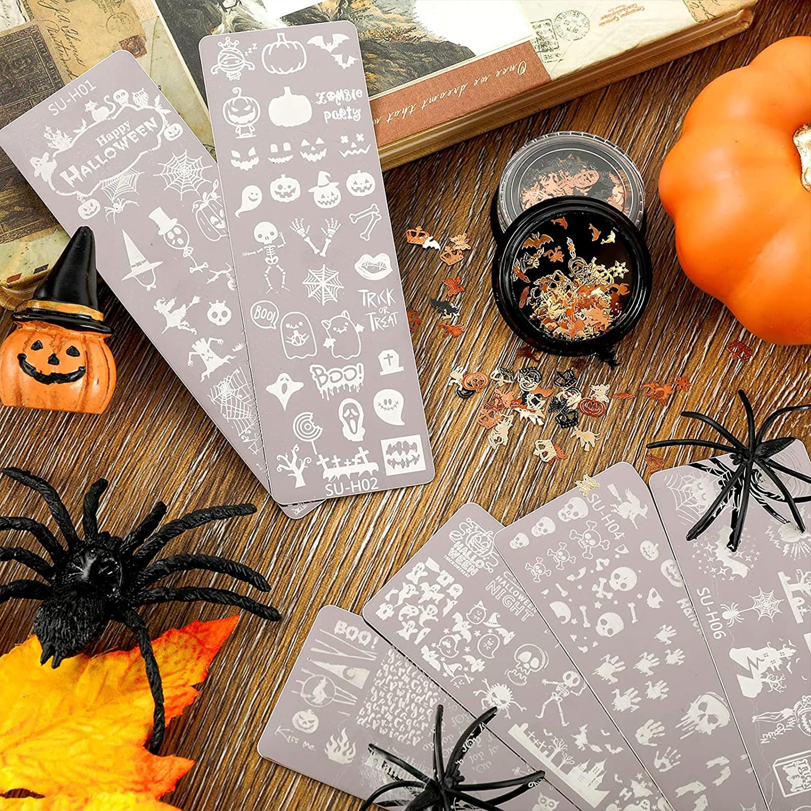 Detailed view of skull and spider web nail stamp patterns