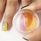 Close up of Maniology clear stamper head for precise nail art