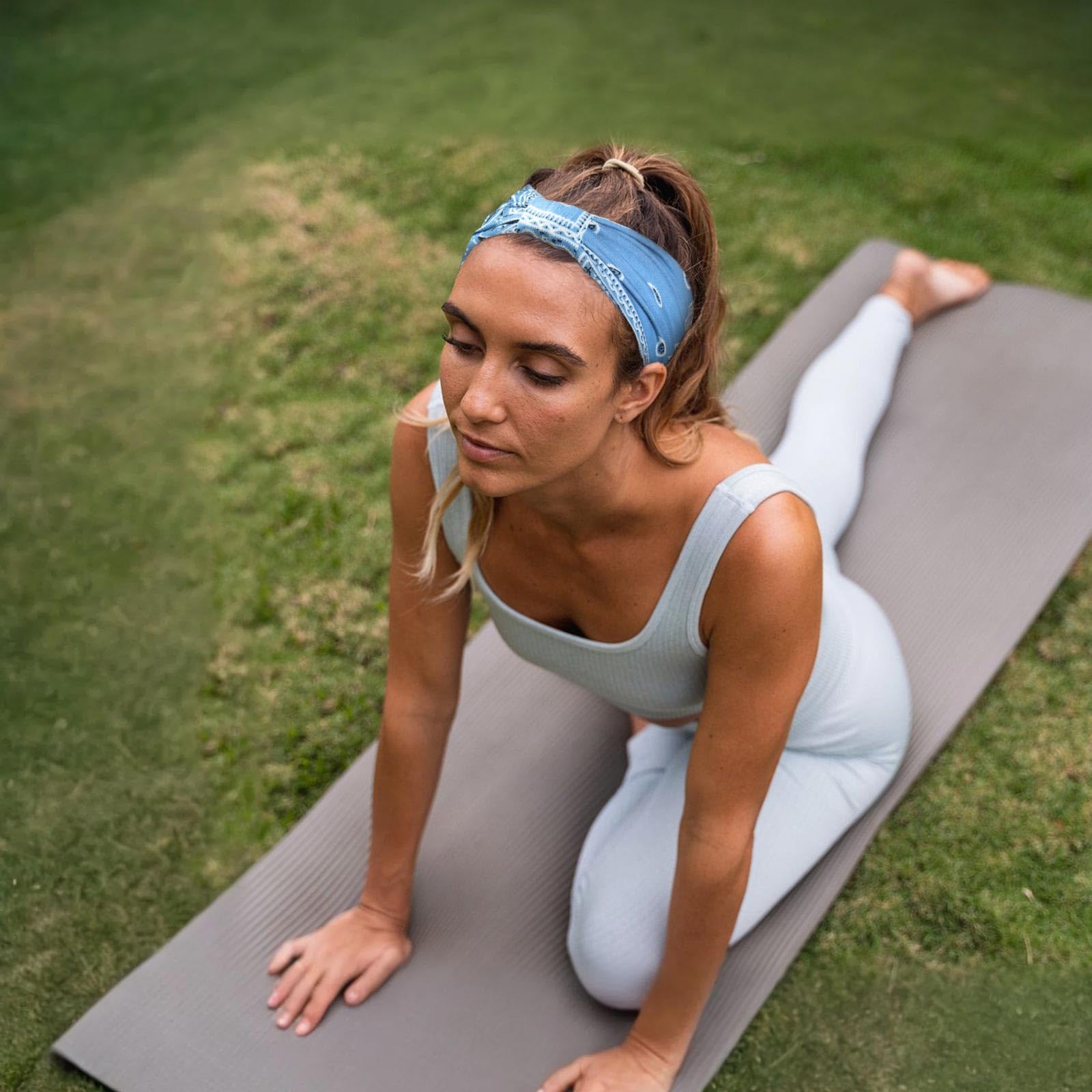 Model wearing soft stretchy wide yoga headband for workout