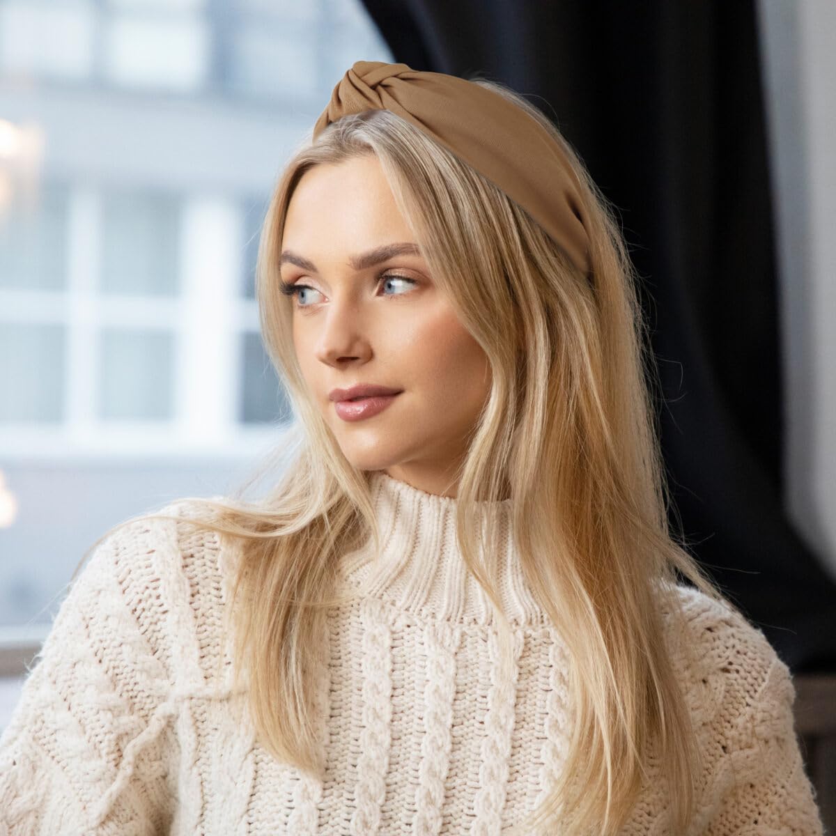 Fashionable women wearing knotted top knot hair hoops