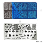 Close up of stainless steel nail stamping plates featuring floral and butterfly designs
