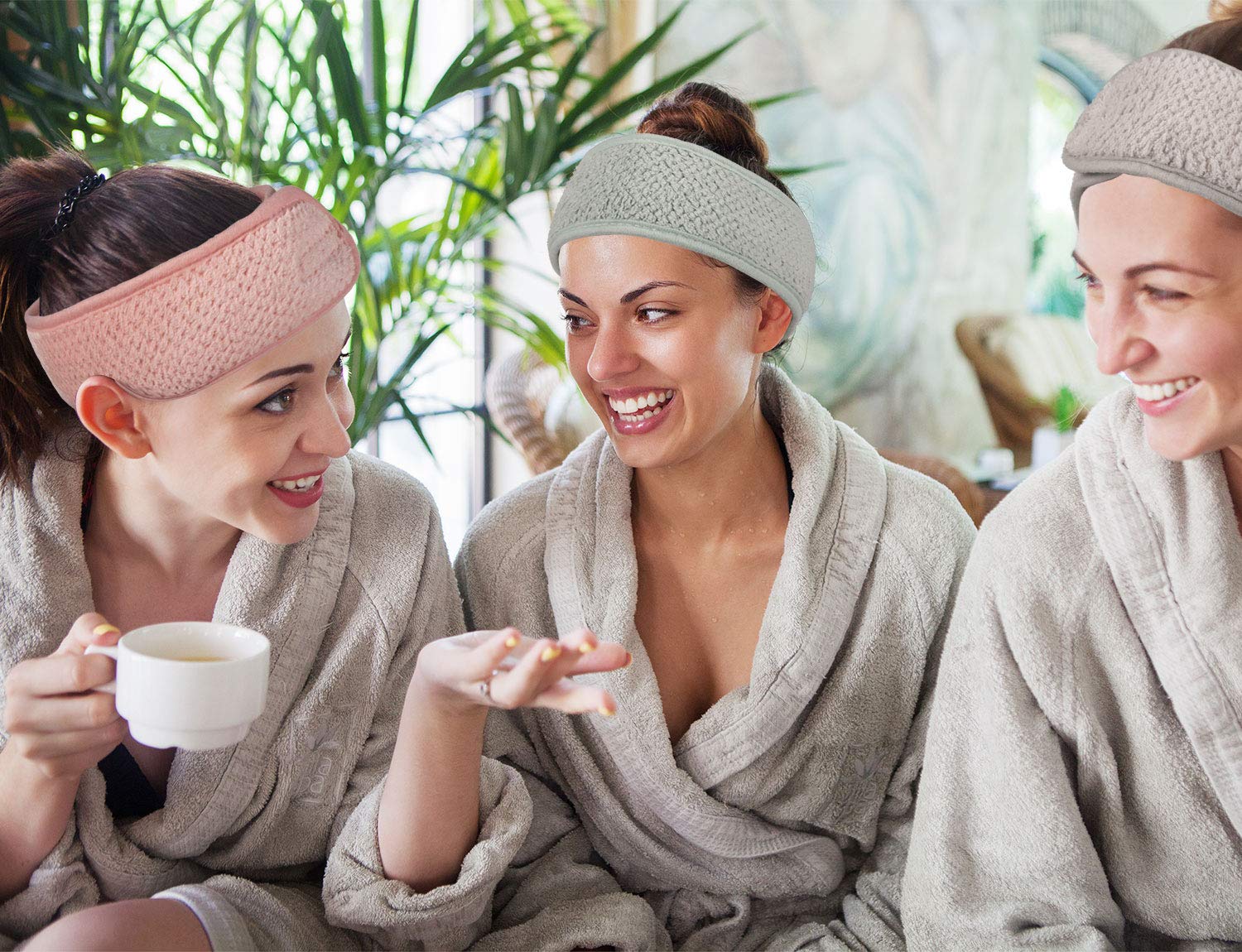 Model using Whaline makeup hair wrap for skincare