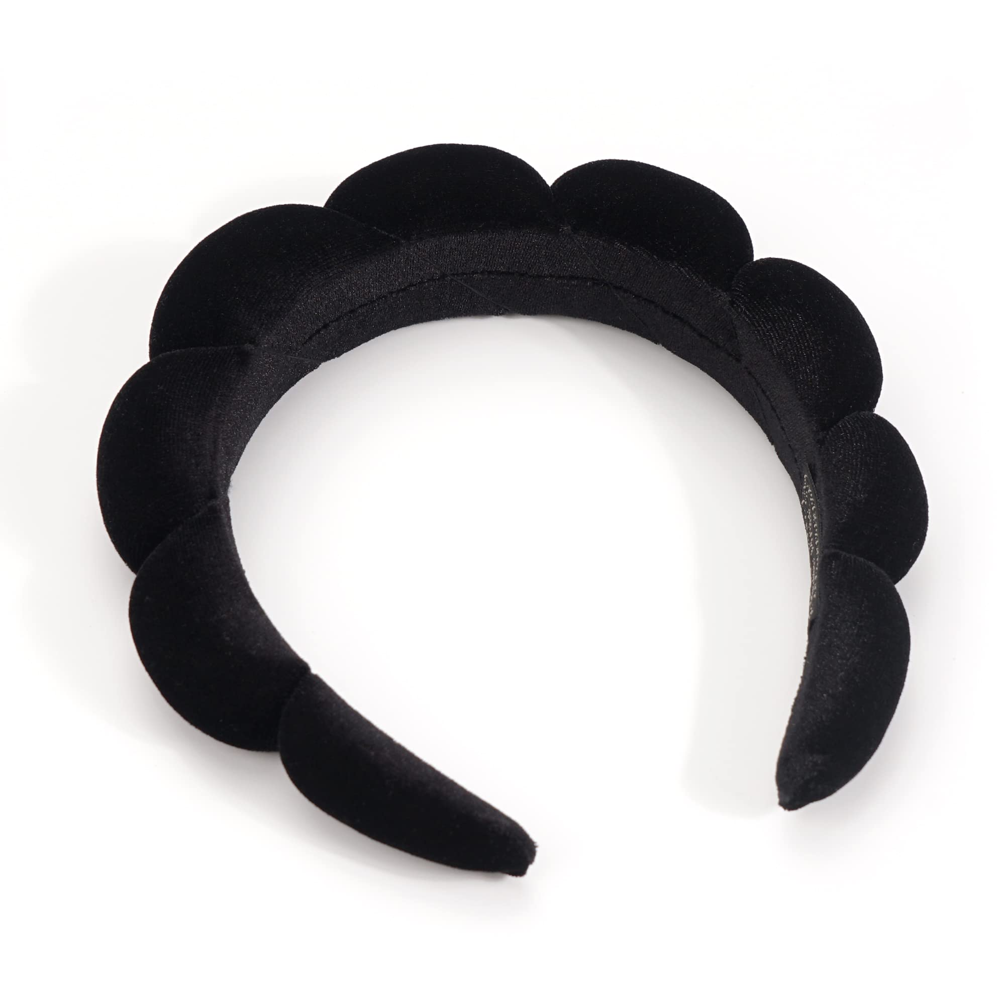 Woman using Ayesha black sponge headband during beauty routine