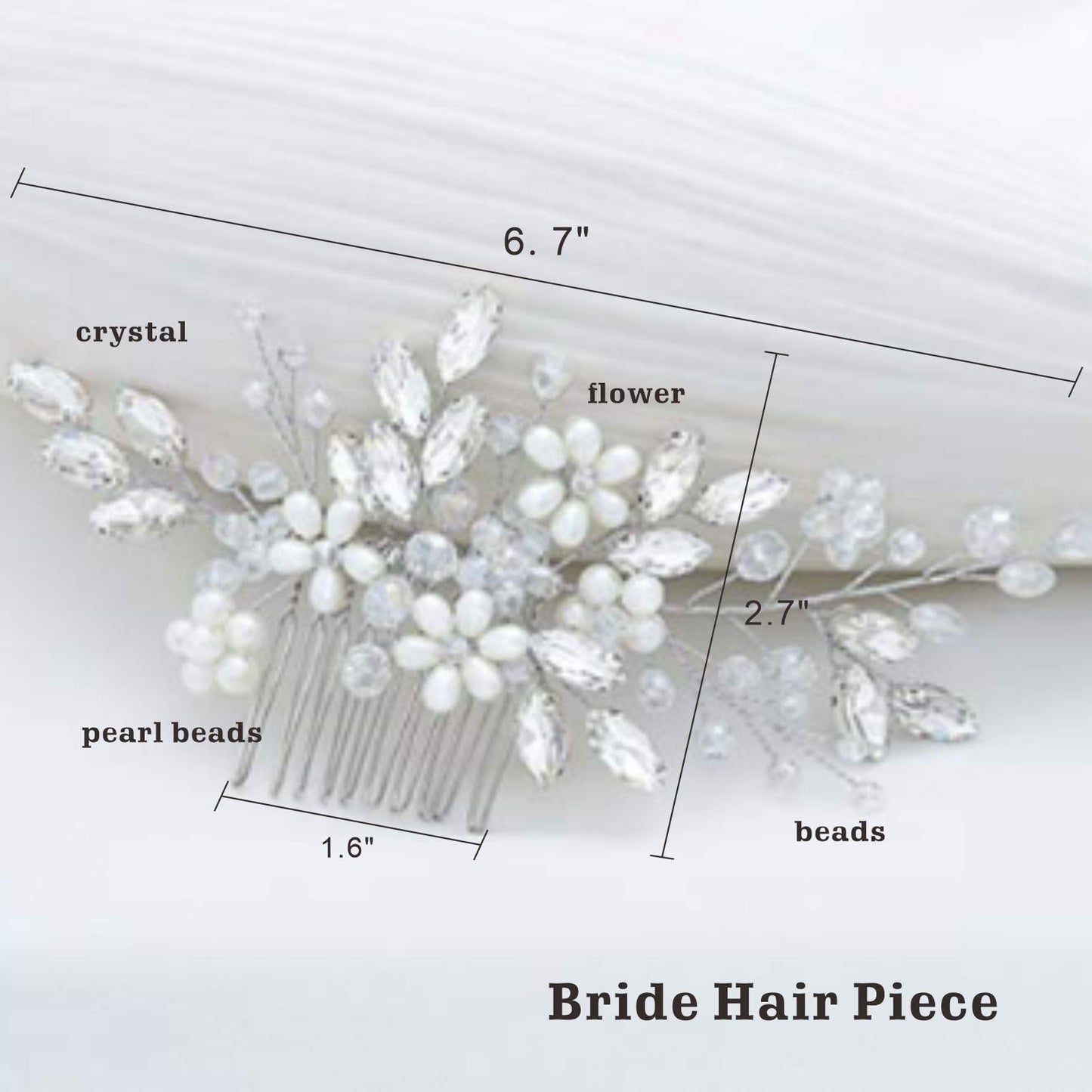 Handcrafted bridal hair piece with rhinestones and faux pearls close up view.