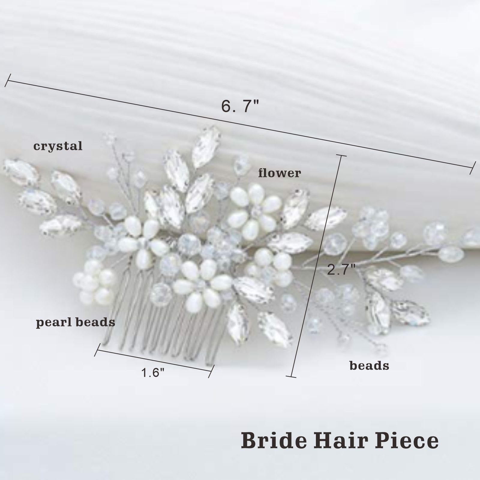Handcrafted bridal hair piece with rhinestones and faux pearls close up view.