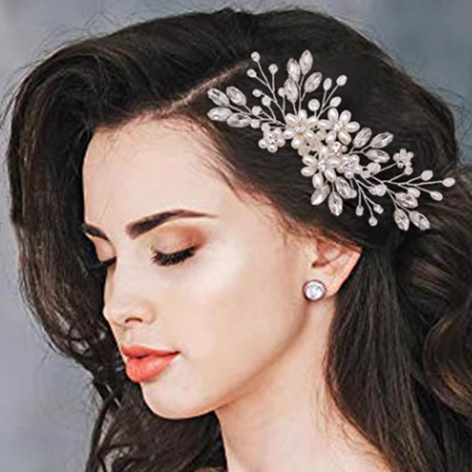 Elegant silver wedding hair comb accessory for women styled in an updo.