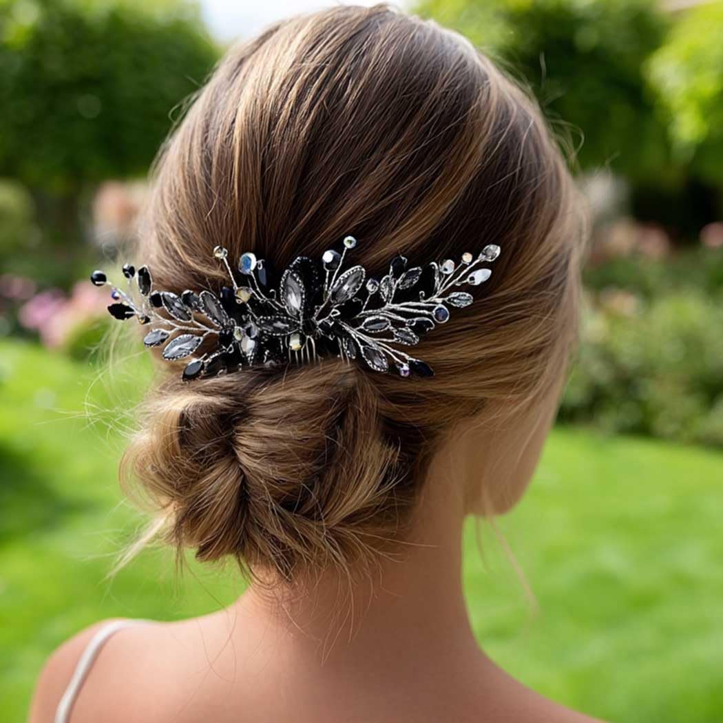 Hand holding Unicra black opal hair comb for size reference