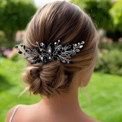 Hand holding Unicra black opal hair comb for size reference