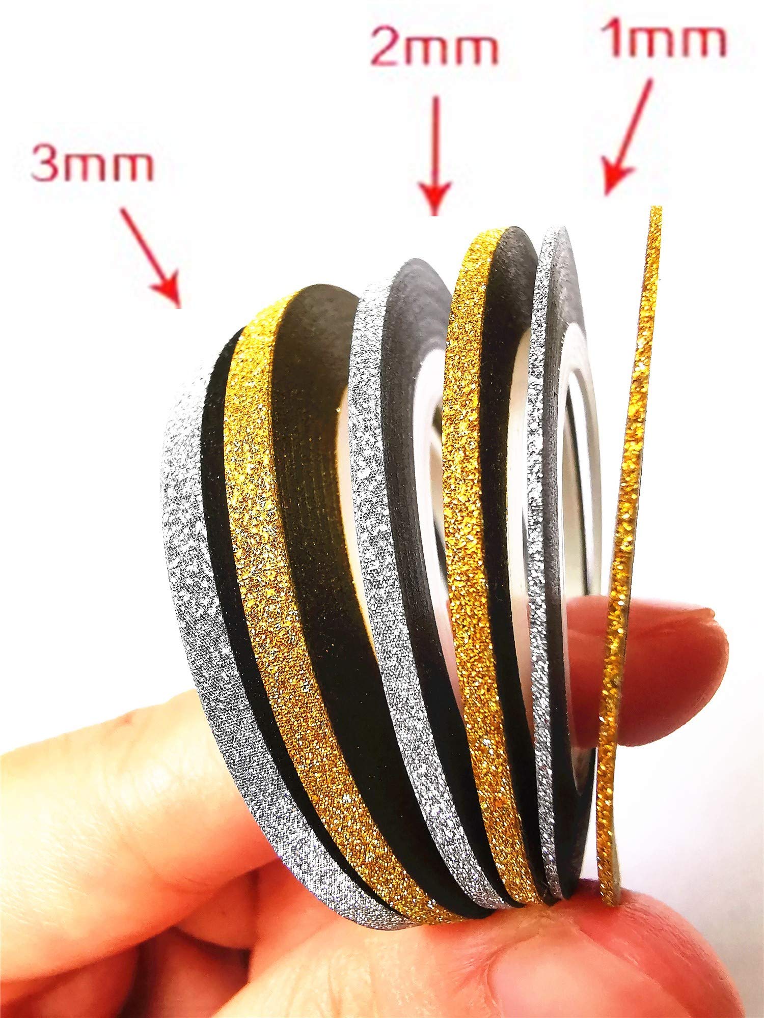 Close up of 1mm 2mm and 3mm gold and silver nail tape rolls