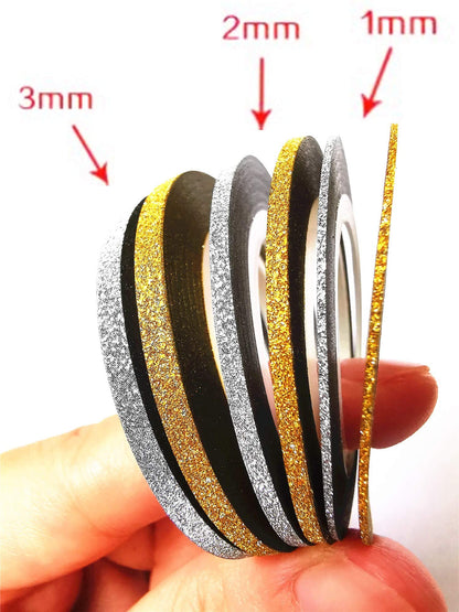 Close up of 1mm 2mm and 3mm gold and silver nail tape rolls