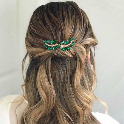 BETITETO wedding rhinestone hair piece placed elegantly on a bridal updo hairstyle