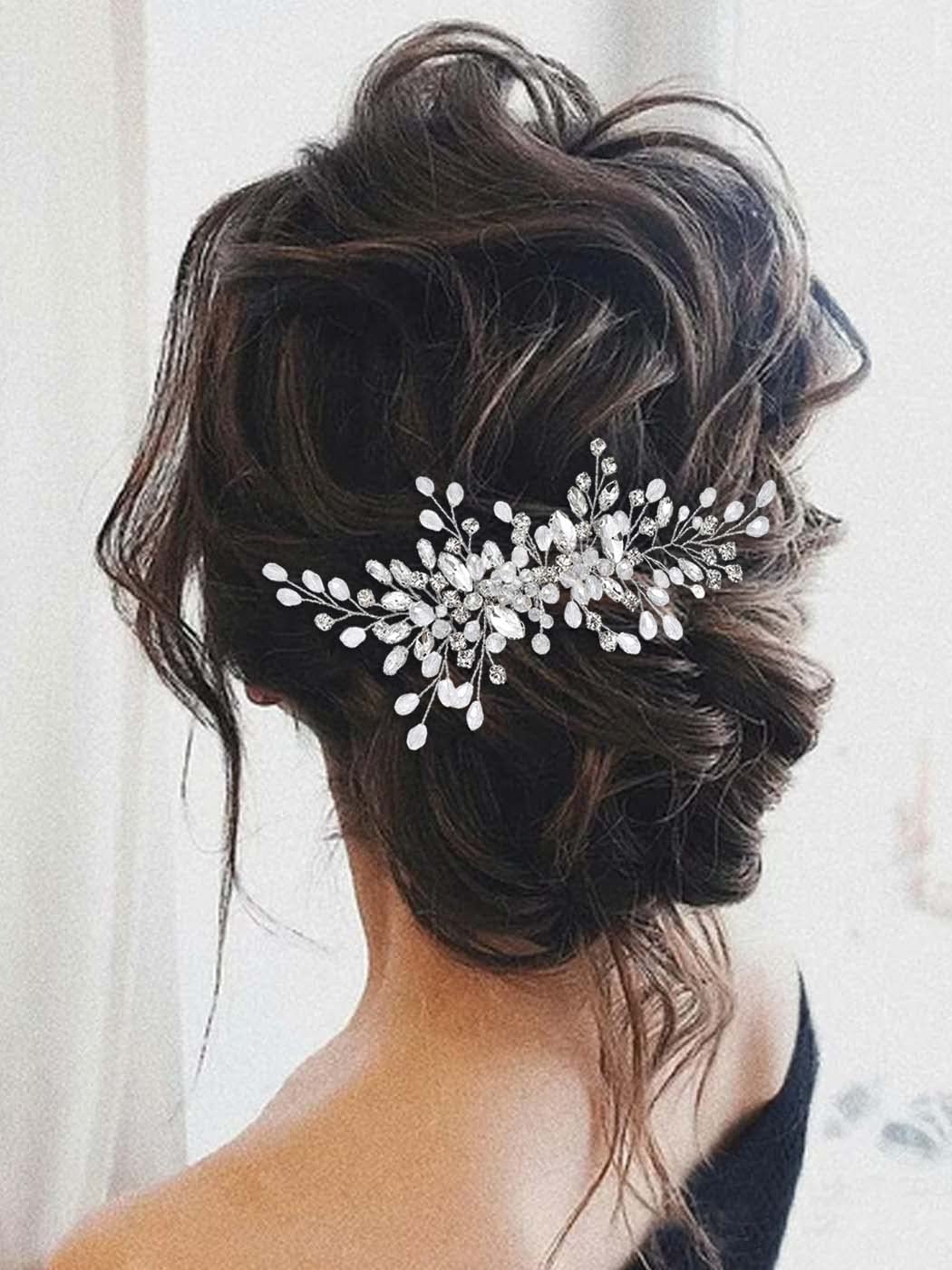 Unicra crystal bridal headpiece styled elegantly in a classic wedding updo hairstyle.