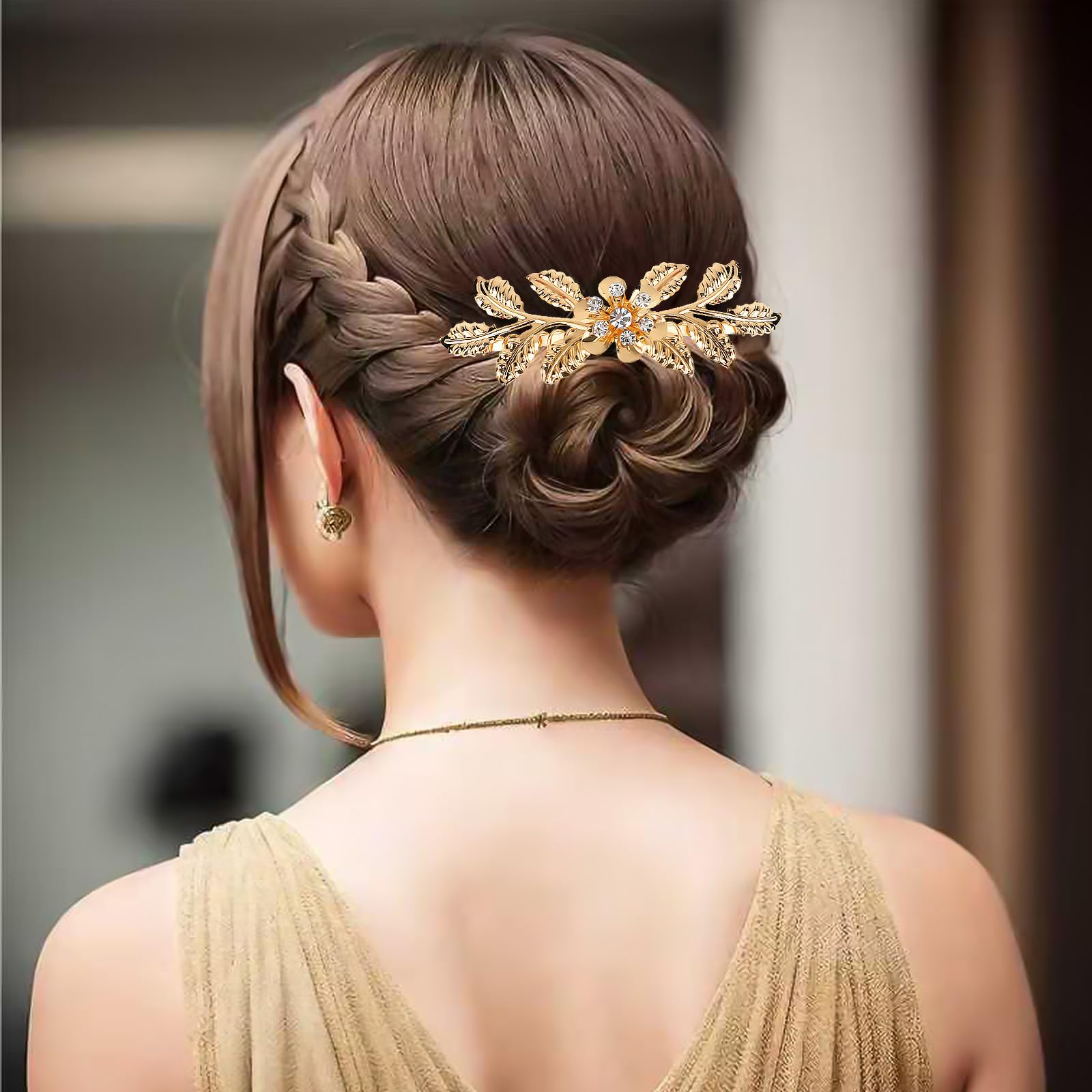 Model showcasing the rhinestone leaf side comb secured in a bridal updo hairstyle.