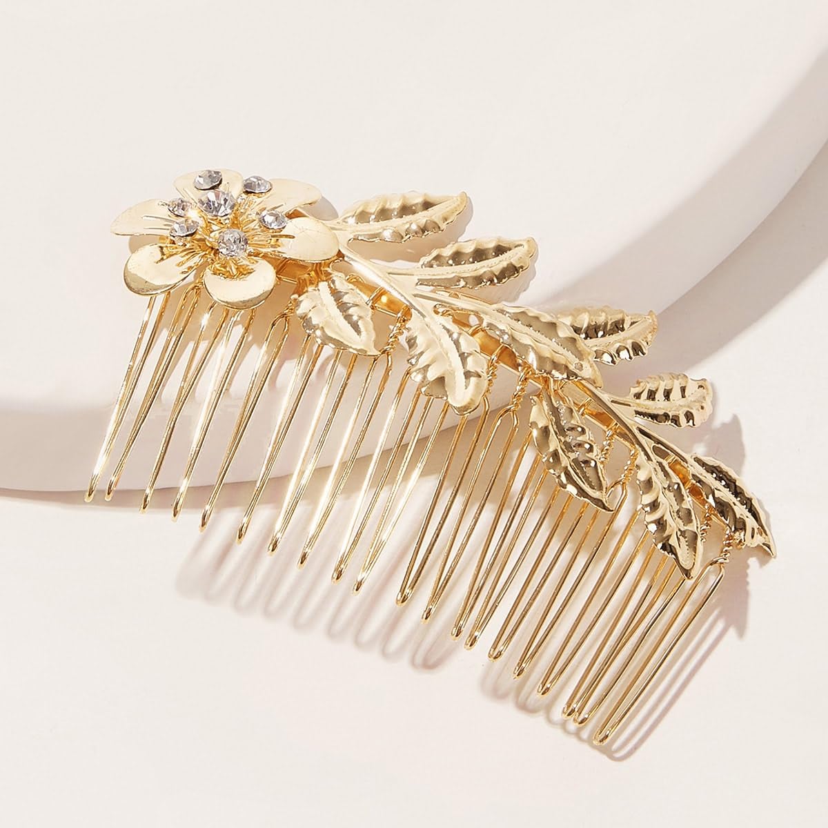The silver metal alloy French twist hair comb clip showing the smooth teeth grip structure.