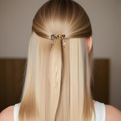 Women using strong hold hair forks to secure a messy bun updo styling routine