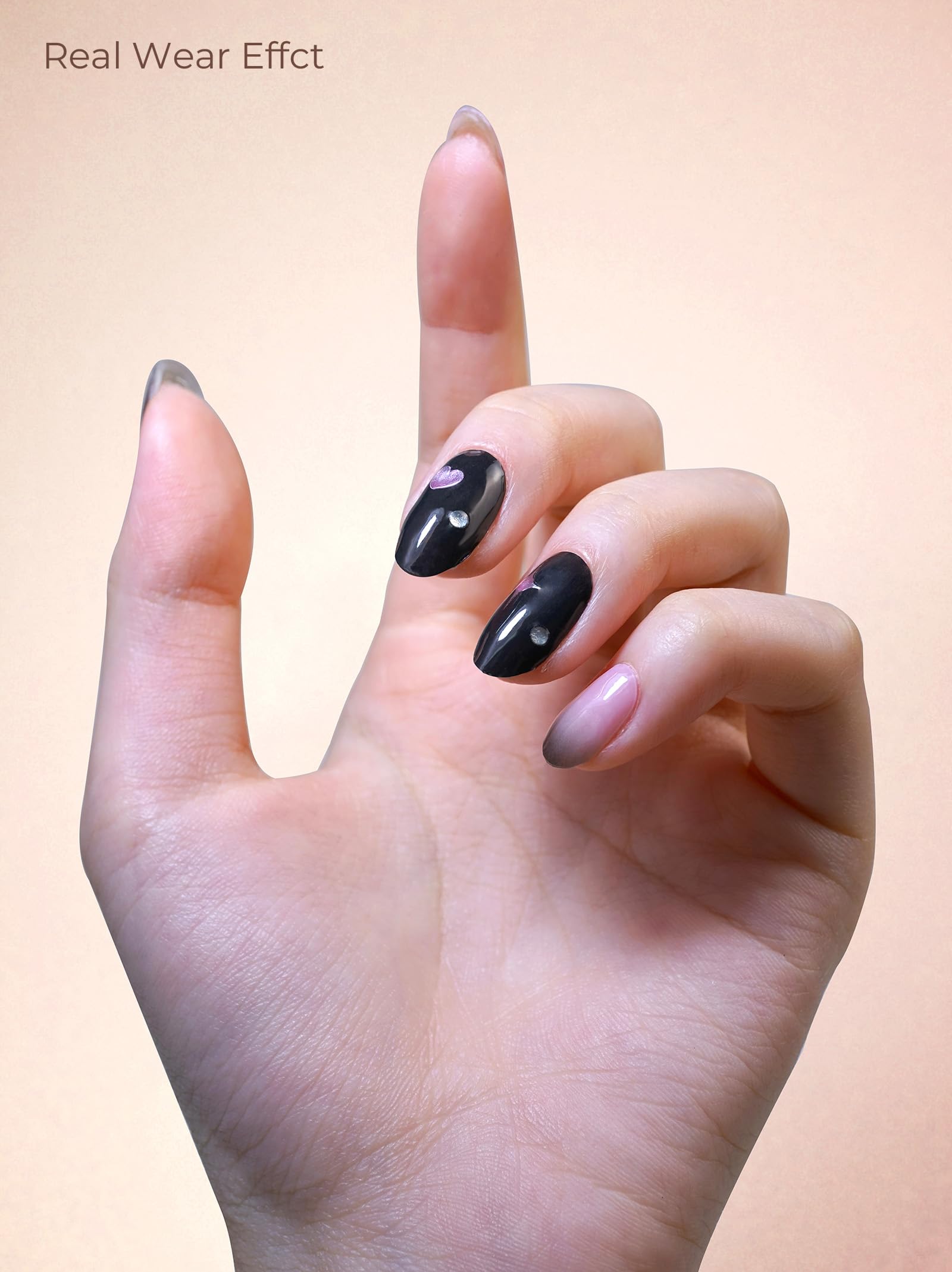 Long lasting white nail polish stickers being smoothed onto a fingernail
