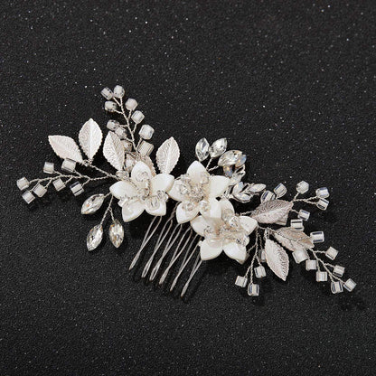 Elegant SWEETV silver crystal hair accessory placed elegantly above a bridal updo hairstyle.