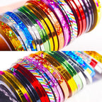 Top-down display of multiple rolls showing glossy and holographic finishes for nail decoration