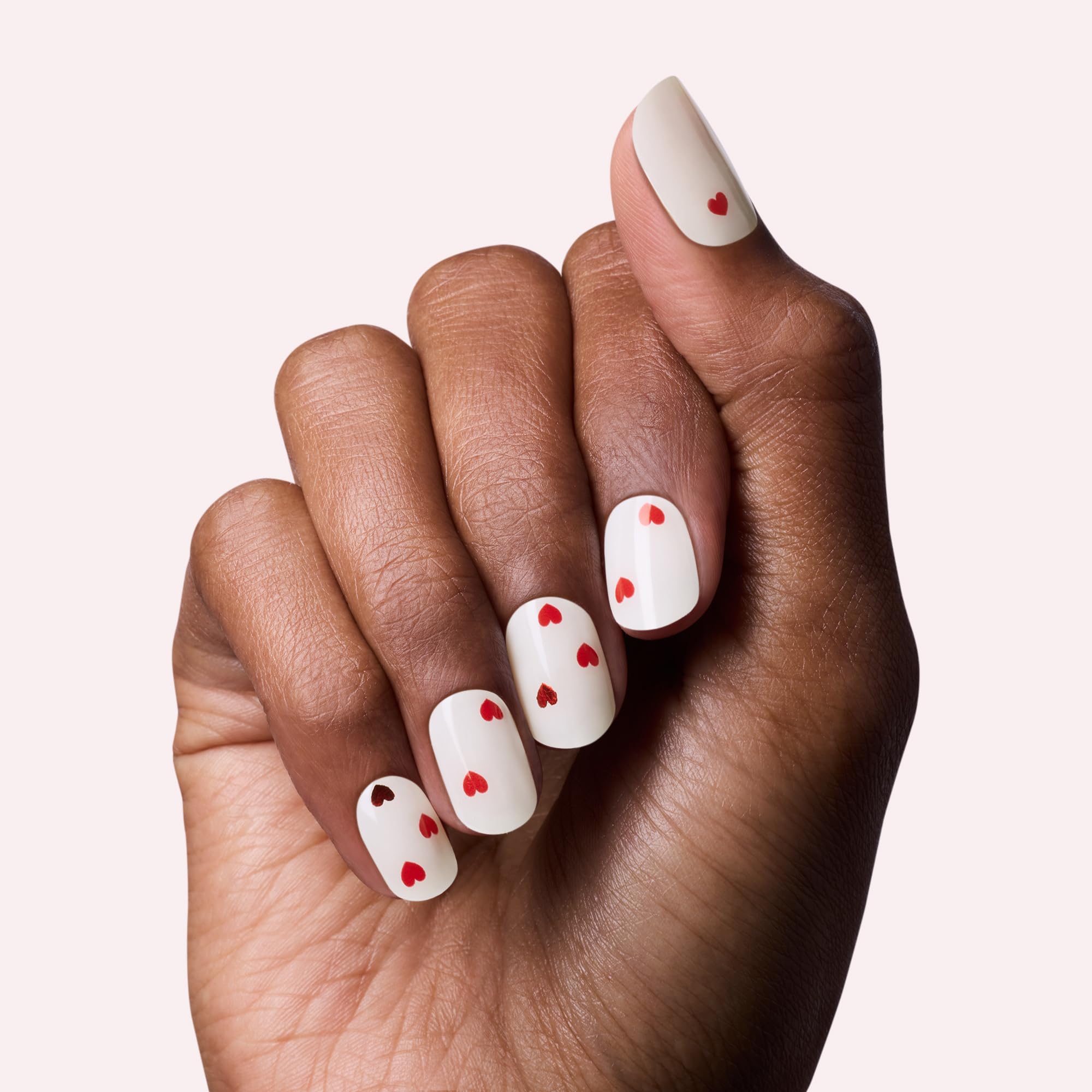 Close-up view of the thirty-two semi-cured gel nail stickers included in the Dashing Diva Valentine manicure kit.