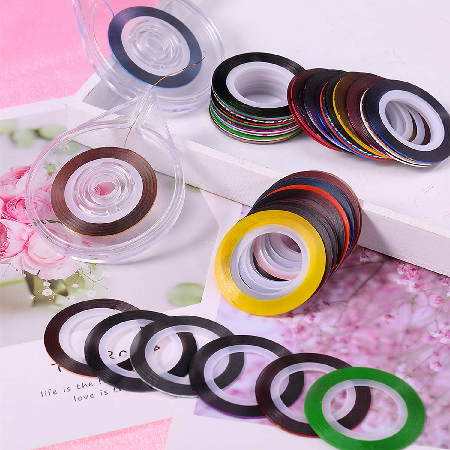 Close up of metallic nail art striping tape rolls in various colors