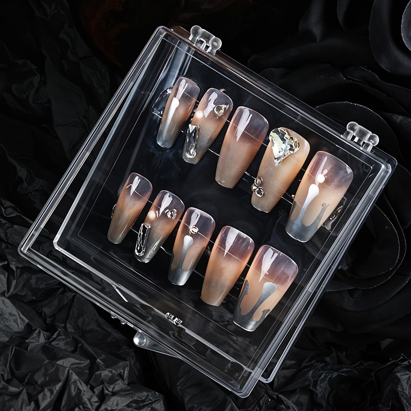 Close up look at the clear flexible adhesive tabs for false nail extension organization