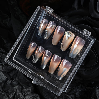 Close up look at the clear flexible adhesive tabs for false nail extension organization