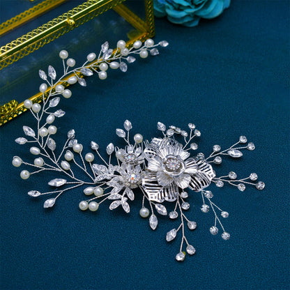Flexible and lightweight bridesmaid hair comb close up view showcasing metallic petals.