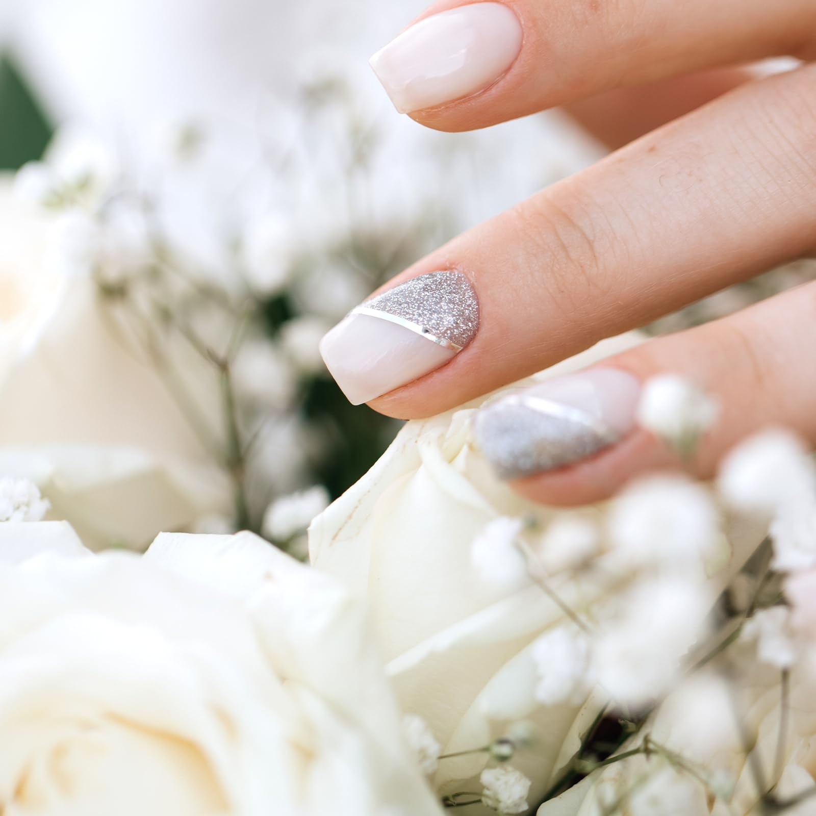 Close up of gold pinstripe tape being applied to a manicured fingernail for geometric art