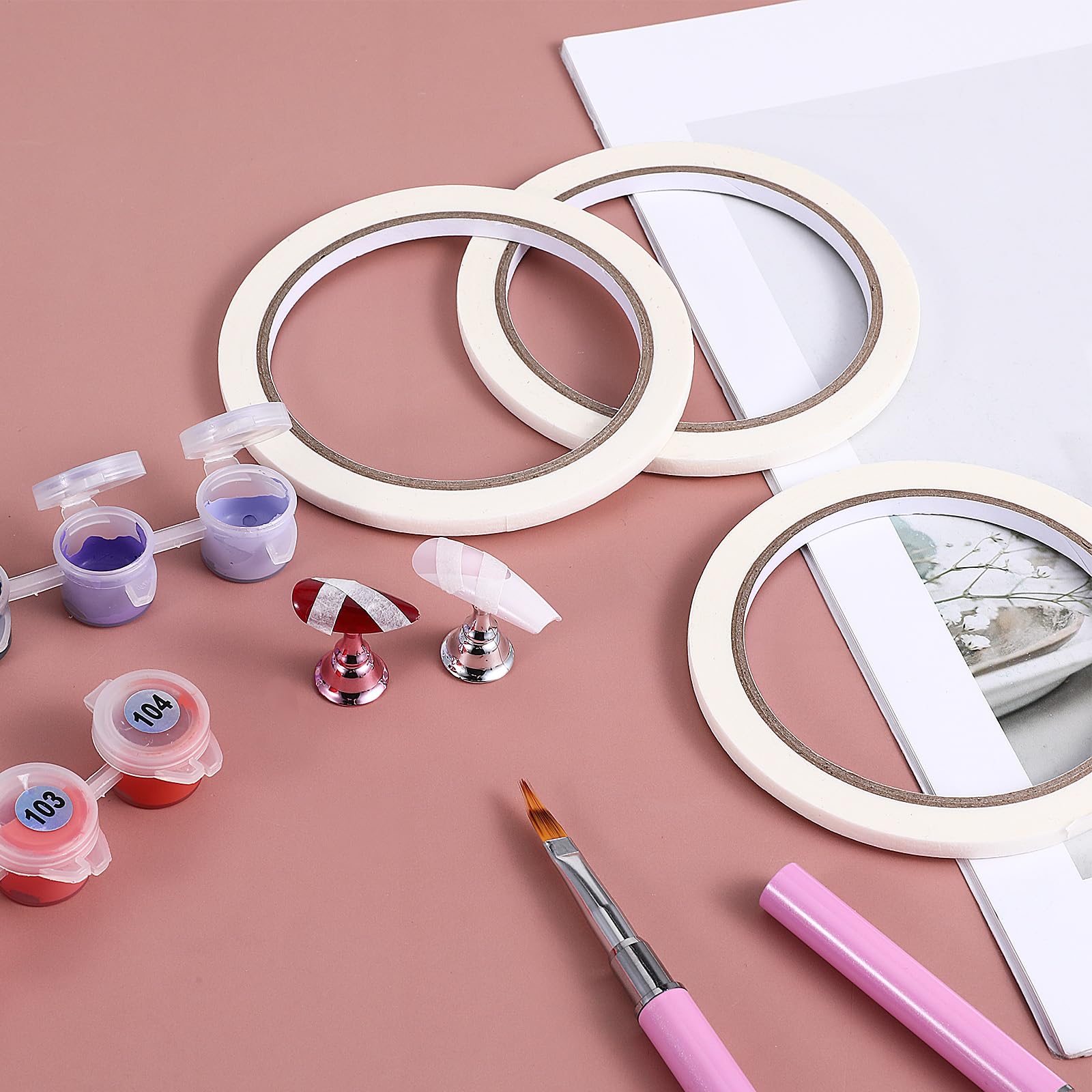 Close up view of the 0.5cm and 1cm white paper masking tapes highlighting the easy tear texture for DIY nail decoration.