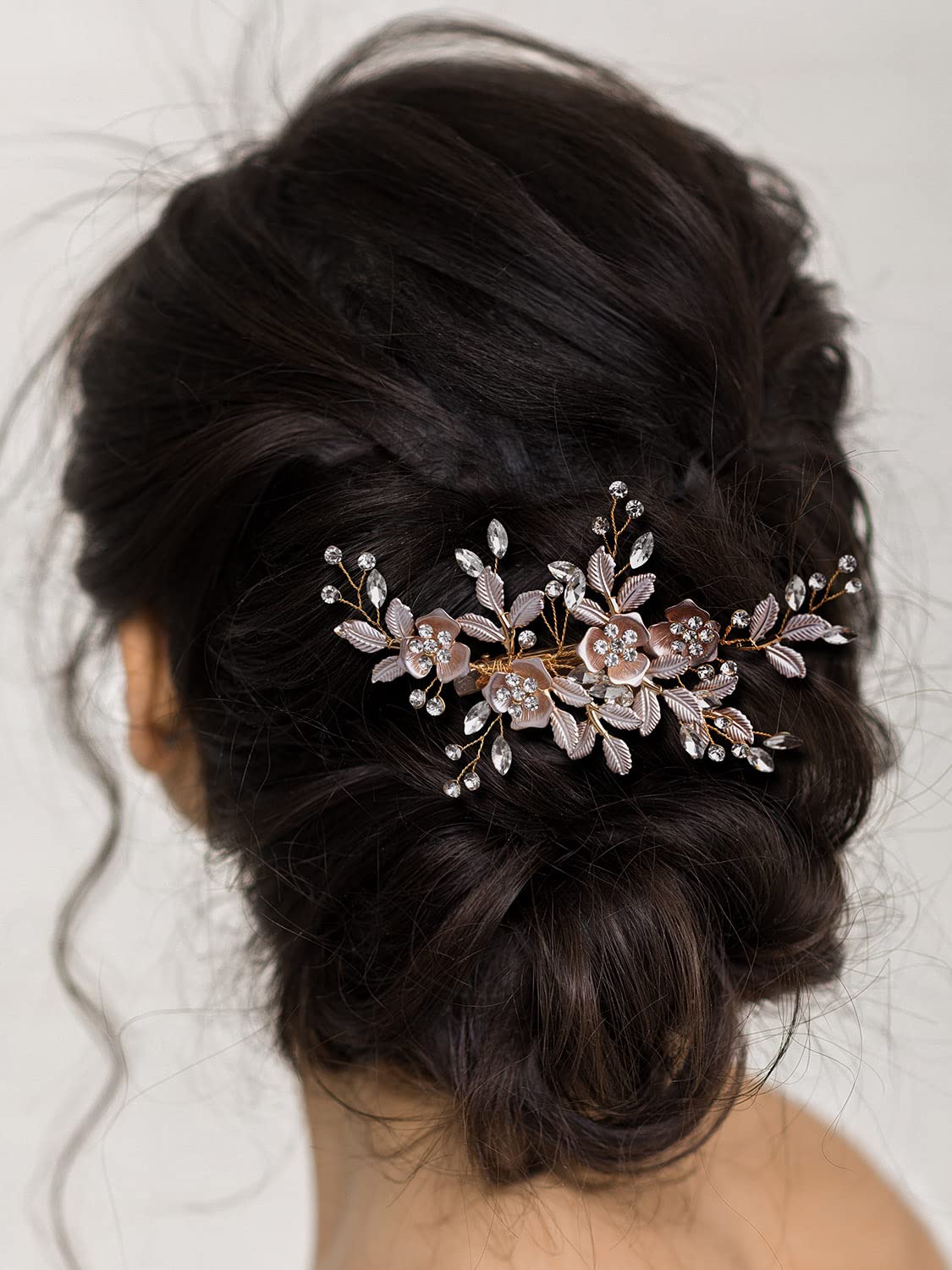 Close up of crystal rhinestone accents on light rose gold hair barrette