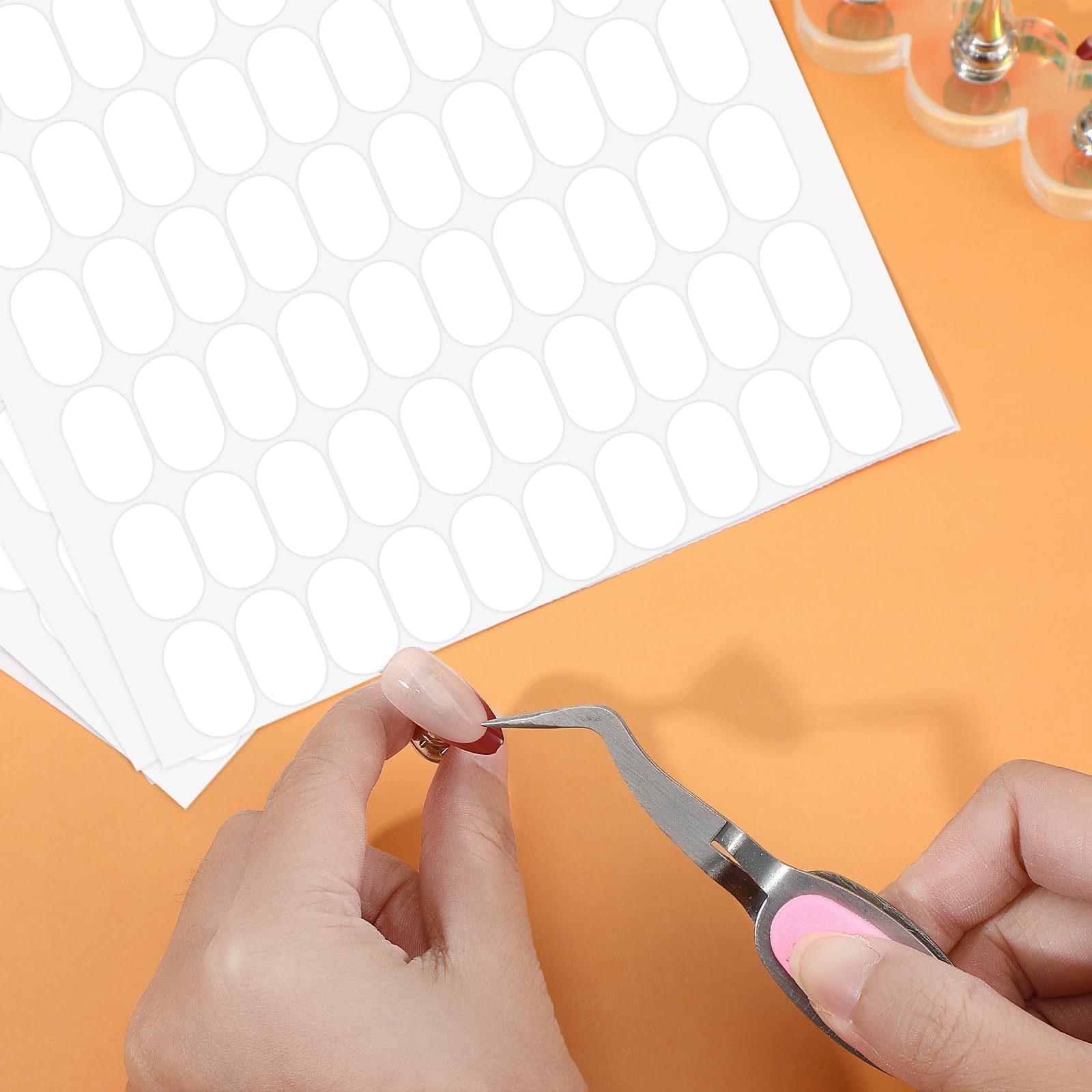 LXUEJIE double sided sticky dots demonstrating residue free removal from a glass surface.