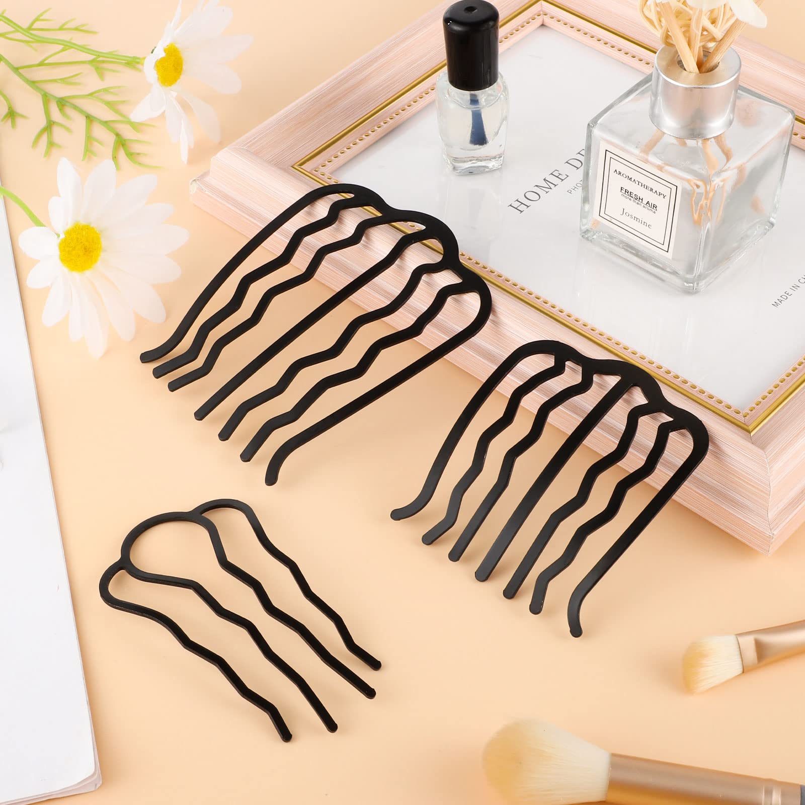 Besarme black metal side combs demonstrating the 4-prong hair tool for securing buns.
