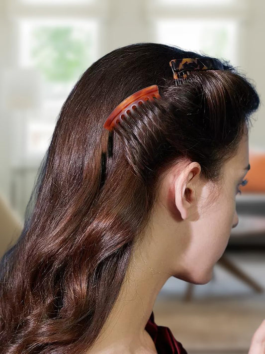 Four piece set of decorative French twist side combs in tortoise and brown colors.