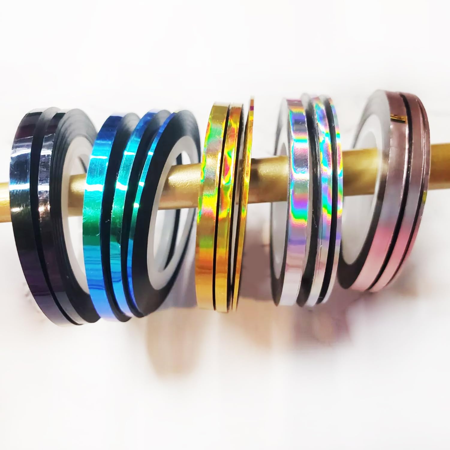 Selection of 1mm 2mm and 3mm nail tape widths for DIY manicure