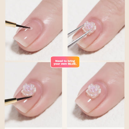 Close up view of 3D flat back camellia flower studs applied onto a salon style manicure.