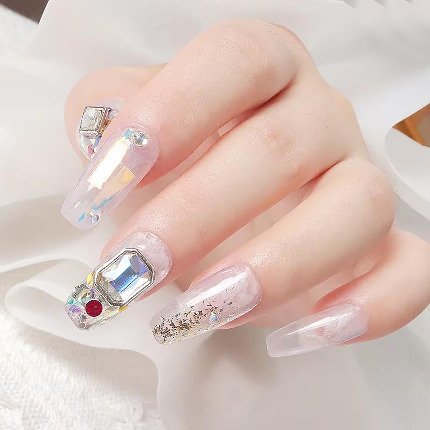 Step by step application of 3D metal frame jewels onto a freshly cured gel nail polish surface