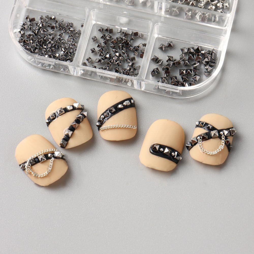 Jaliya nail art rivets applied on model nails