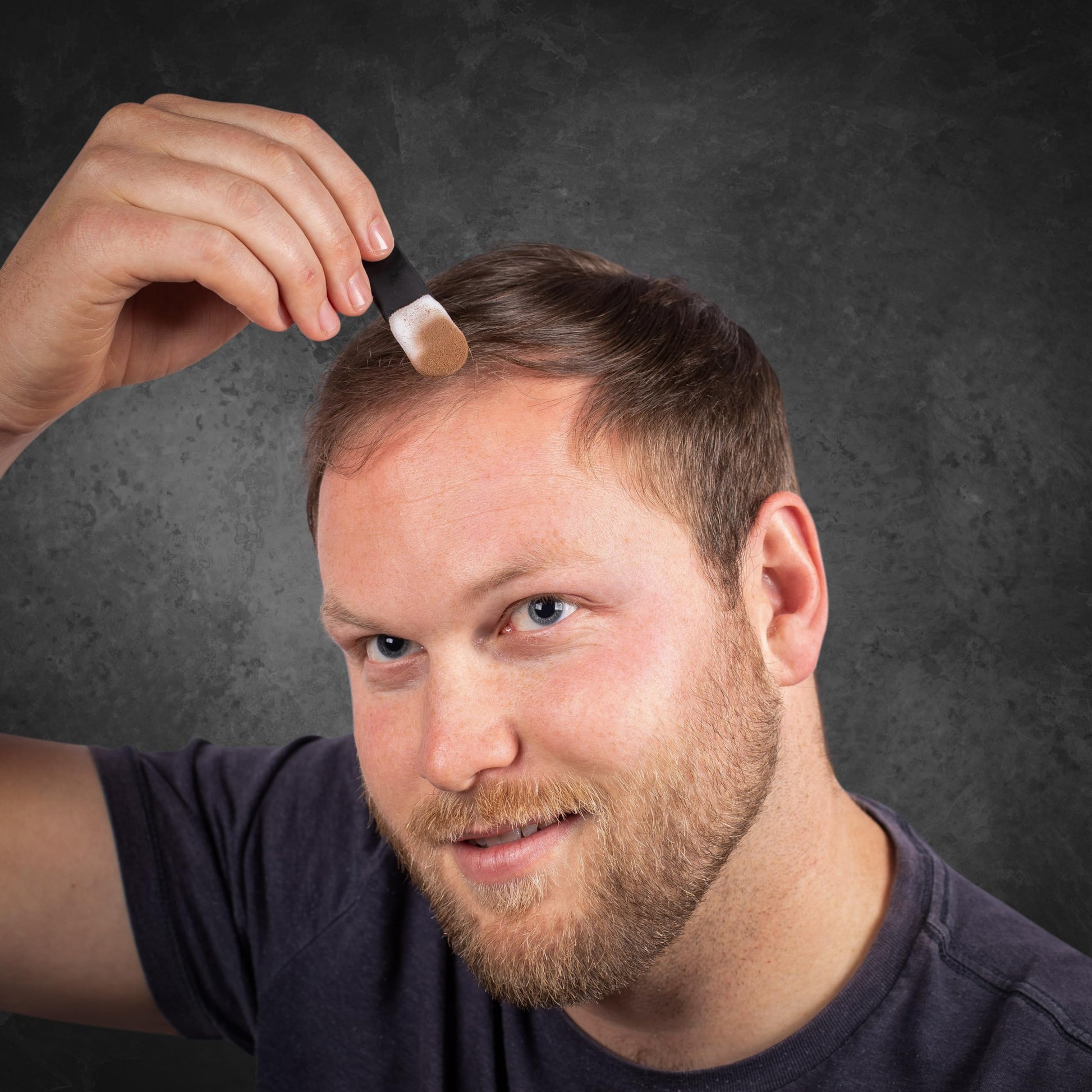 Grooming accessory showing the sturdy black handle grip for precise scalp powder placement