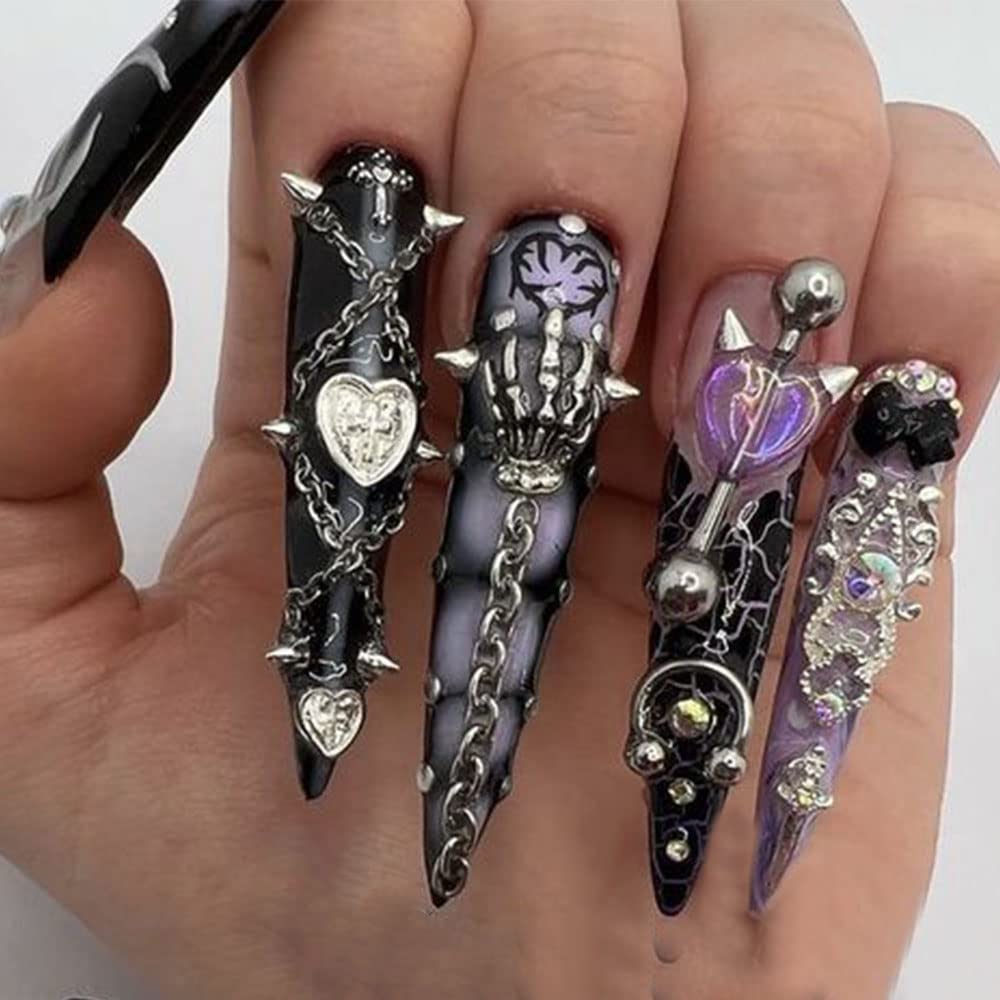 Close up view of gold alloy cone nail studs for 3D gothic nail art designs