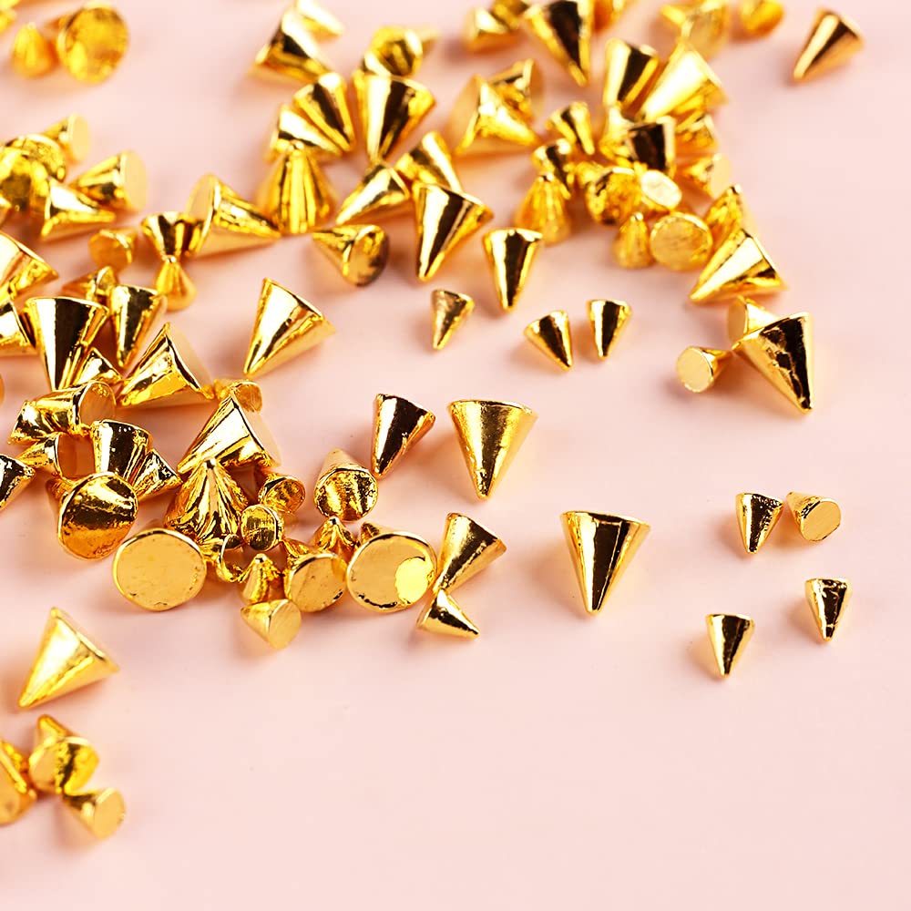 Silver punk style flat back rivet nail jewels arranged on acrylic nail tips