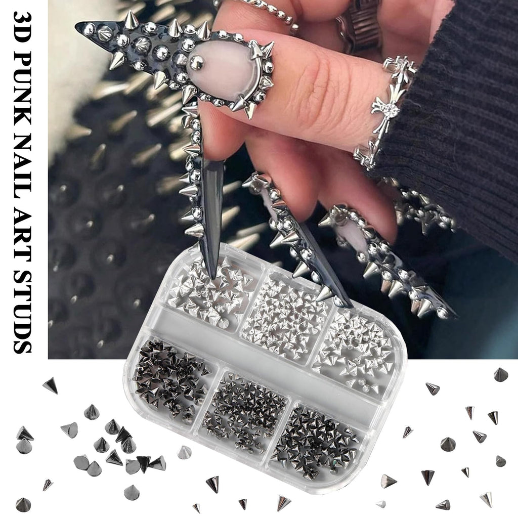 Close-up view of 3D geometric gold metal nail charms and studs